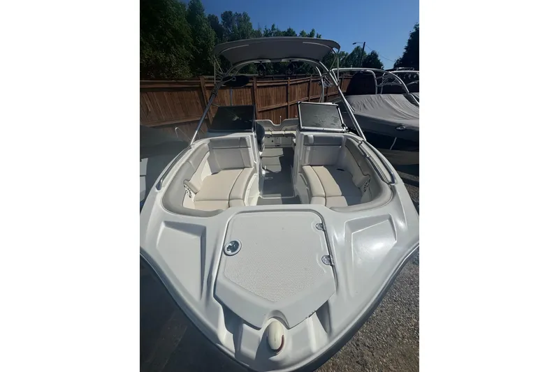 Slide: The Image of 2012 Yamaha AR210 boat with spacious seating and sleek design. - 9