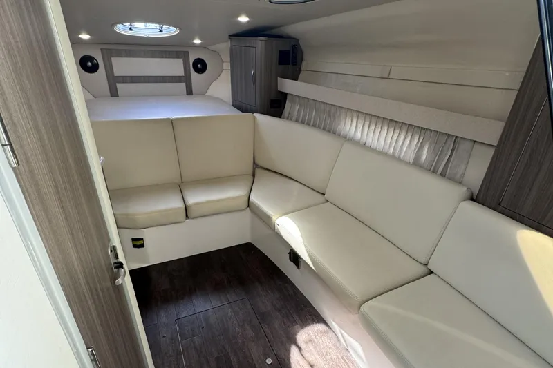 Slide: The Image of Interior of 2020 Regal 33 XO yacht with beige seating and wood accents. - 15