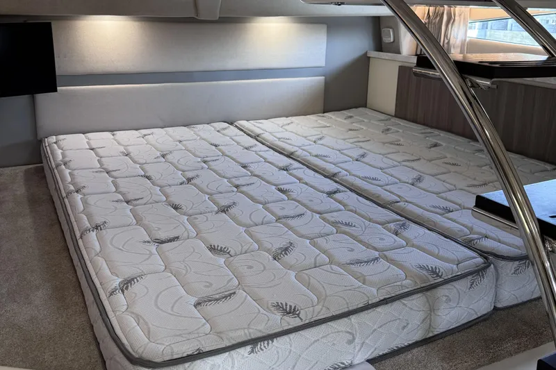 Slide: The Image of Interior cabin of 2020 Regal 33 XO yacht with comfortable bedding. - 16