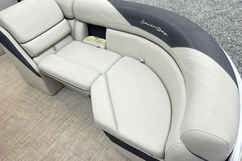 Slide: The Image of Luxurious 2022 South Bay LE boat seating with cup holders and elegant design. - 8