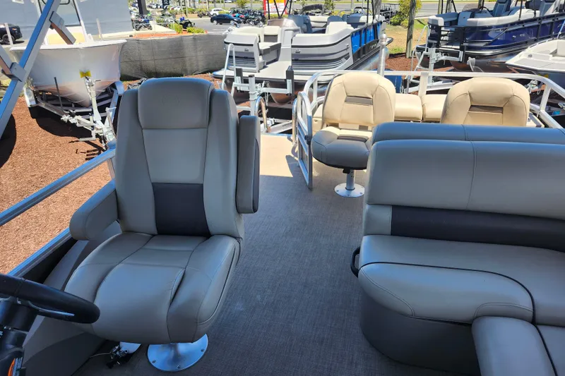 Slide: The Image of 2023 Sun Tracker Fishin' Barge 22 XP3 interior with comfortable seating and modern design. - 13