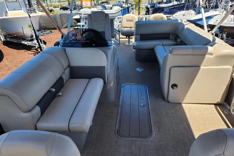 Slide: The Image of 2023 Sun Tracker Fishin' Barge 22 XP3 interior with spacious seating and modern design. - 18