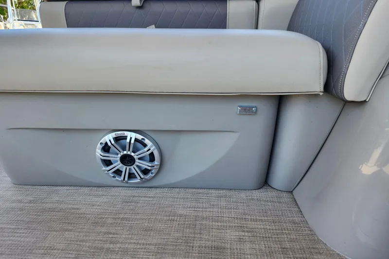 Slide: The Image of 2023 Sun Tracker Fishin' Barge 22 XP3 interior seating with built-in speaker. - 31