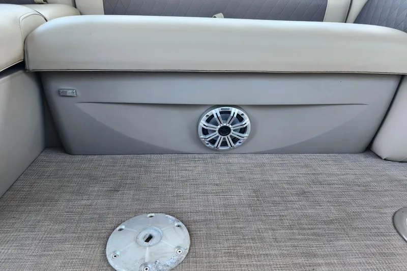 Slide: The Image of Interior of 2023 Sun Tracker Fishin' Barge 22 XP3 with speaker and seating. - 33