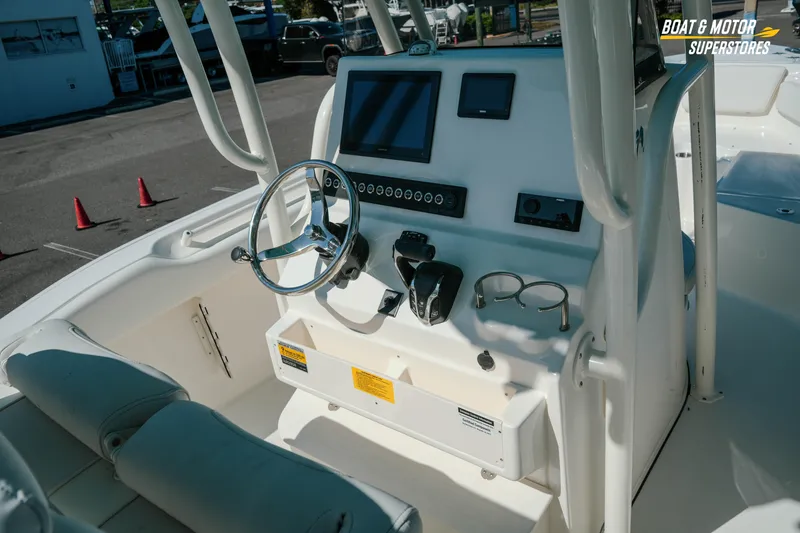 Slide: The Image of 2026 Key West 239 FS boat console with steering wheel and navigation controls. - 12