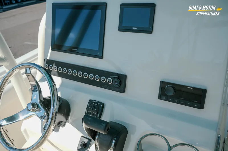 Slide: The Image of 2026 Key West 239 FS boat dashboard with Garmin and Yamaha displays. - 13