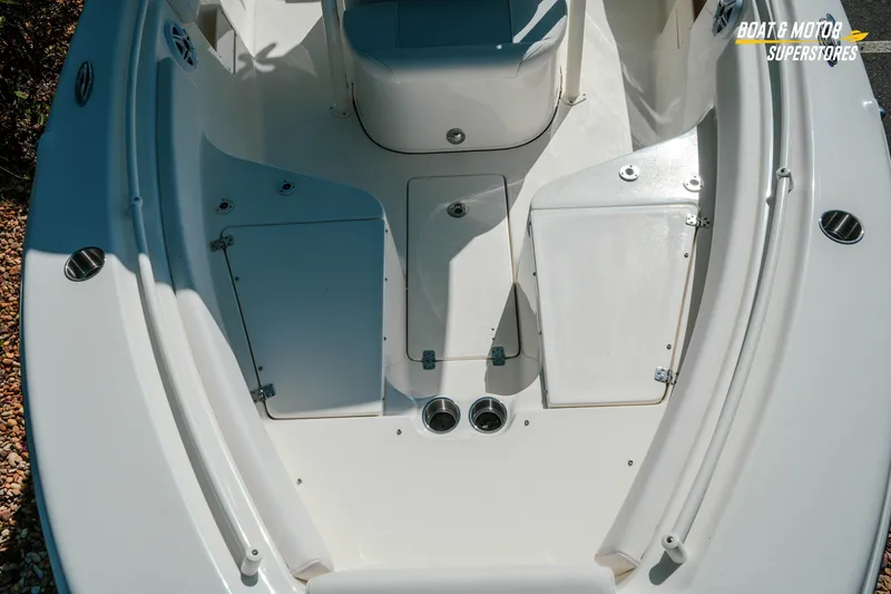 Slide: The Image of 2026 Key West 239 FS boat interior with storage compartments and seating. - 16