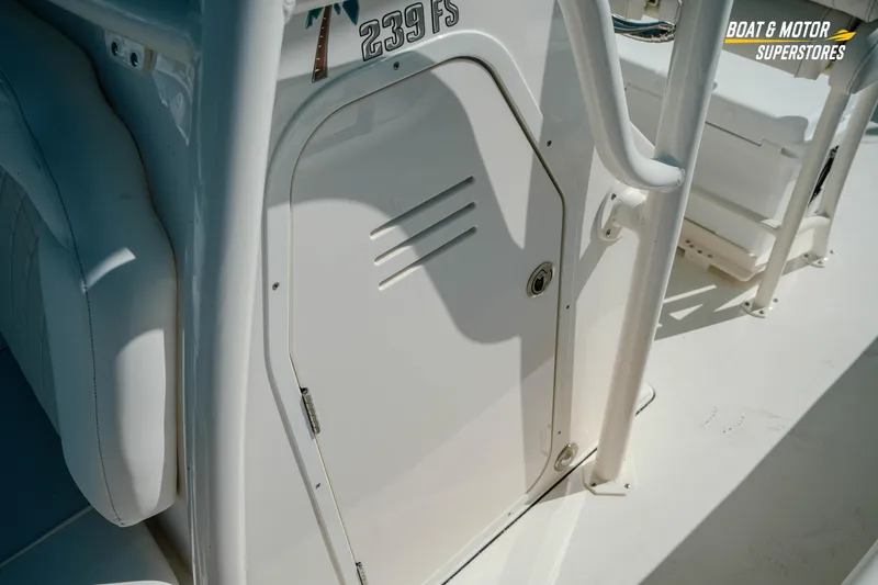 Slide: The Image of 2026 Key West 239 FS boat interior, featuring a sleek white console door. - 20