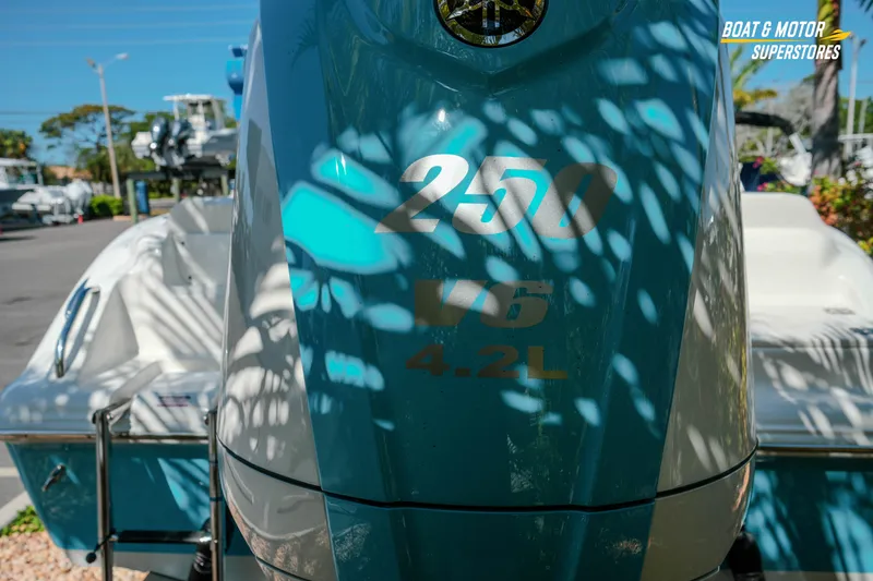 Slide: The Image of 2026 Key West 239 FS boat with 250 V6 4.2L engine, outdoor display. - 5