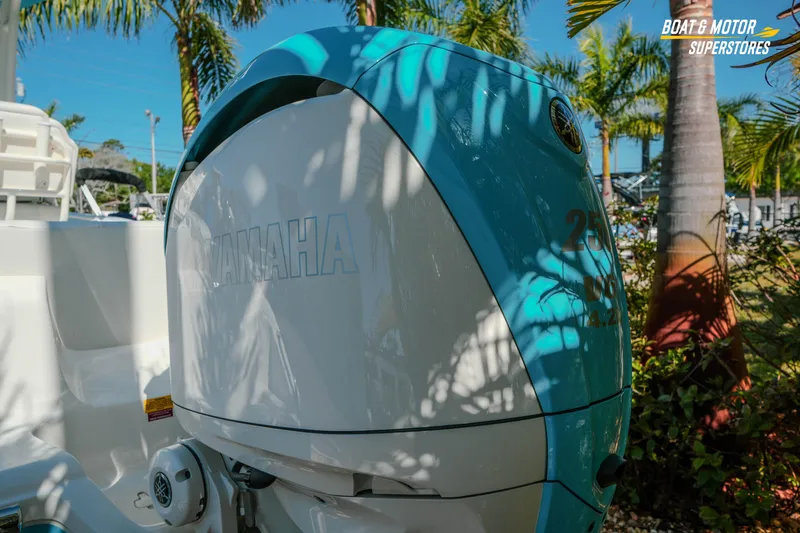 Slide: The Image of 2026 Key West 239 FS boat with Yamaha engine, surrounded by palm trees. - 6