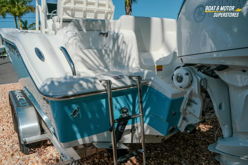 Slide: The Image of 2026 Key West 239 FS boat rear view with ladder and Yamaha motor. - 7