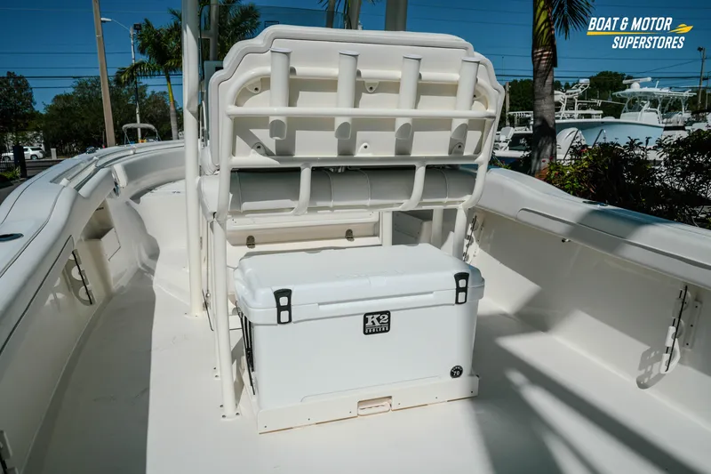 Slide: The Image of 2026 Key West 239 FS boat interior with cooler, showcasing spacious deck and seating. - 8