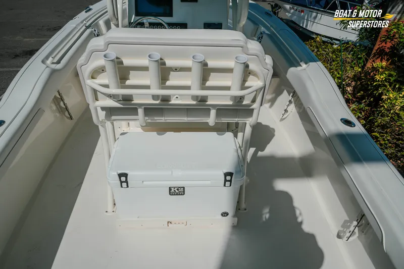 Slide: The Image of 2026 Key West 239 FS boat interior with rod holders and cooler. - 9
