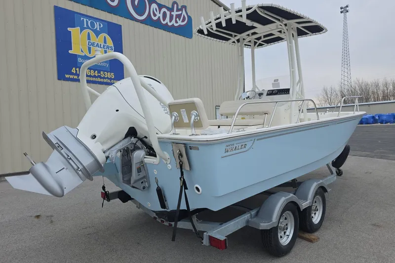 Slide: The Image of 2026 Boston Whaler 190 Montauk boat on trailer, displayed at dealership. - 3