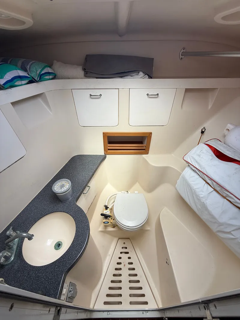 Slide: The Image of Interior of 2000 Luhrs Tournament 290 Open with toilet and sink. - 14