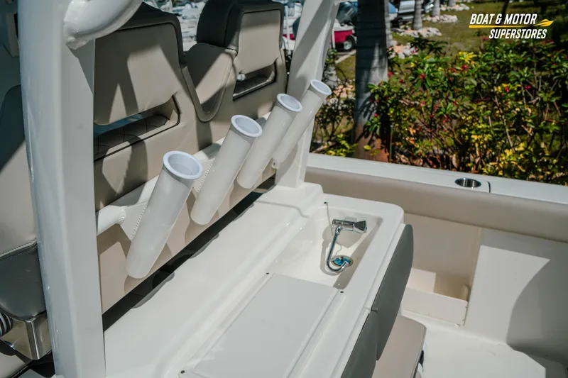 Slide: The Image of 2026 Key West 260 Center Console boat interior with rod holders and seating. - 10