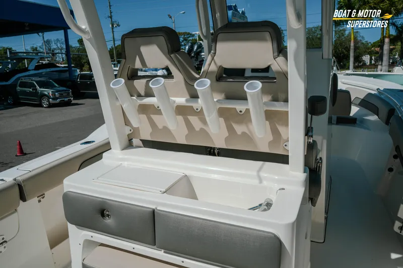 Slide: The Image of 2026 Key West 260 Center Console boat interior with rod holders and seating. - 13