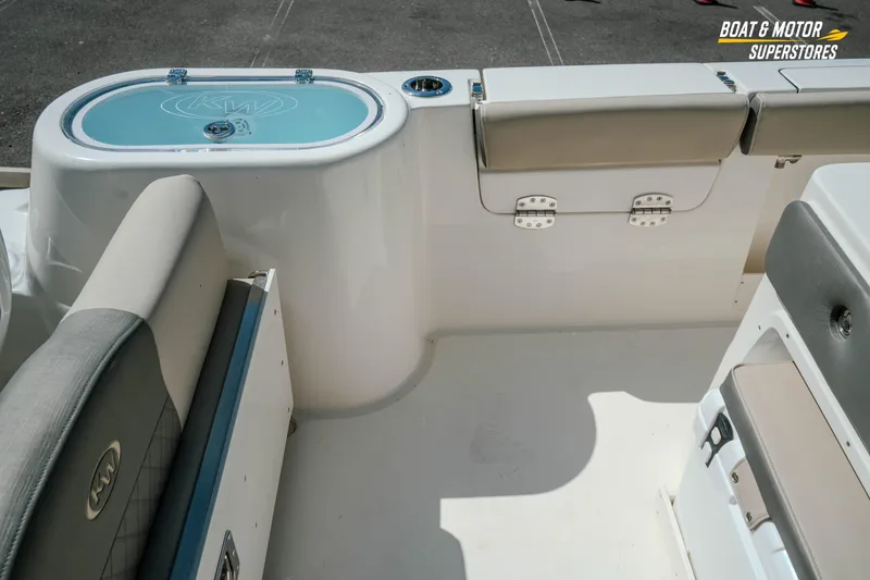 Slide: The Image of 2026 Key West 260 Center Console boat interior with seating and storage compartments. - 15