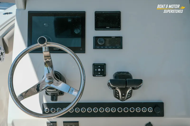 Slide: The Image of Steering console of 2026 Key West 260 Center Console boat with modern controls. - 19
