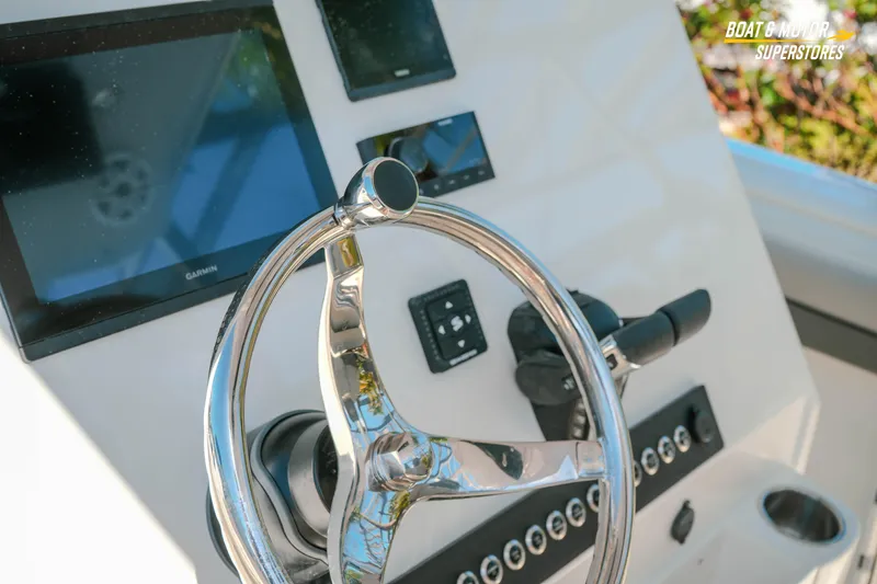 Slide: The Image of 2026 Key West 260 Center Console boat helm with modern controls and displays. - 20
