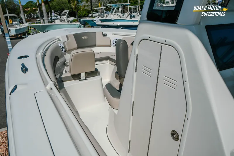 Slide: The Image of 2026 Key West 260 Center Console boat interior with seating and storage compartments. - 21