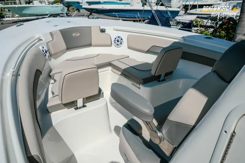 Slide: The Image of 2026 Key West 260 Center Console boat interior with cushioned seating and modern design. - 22