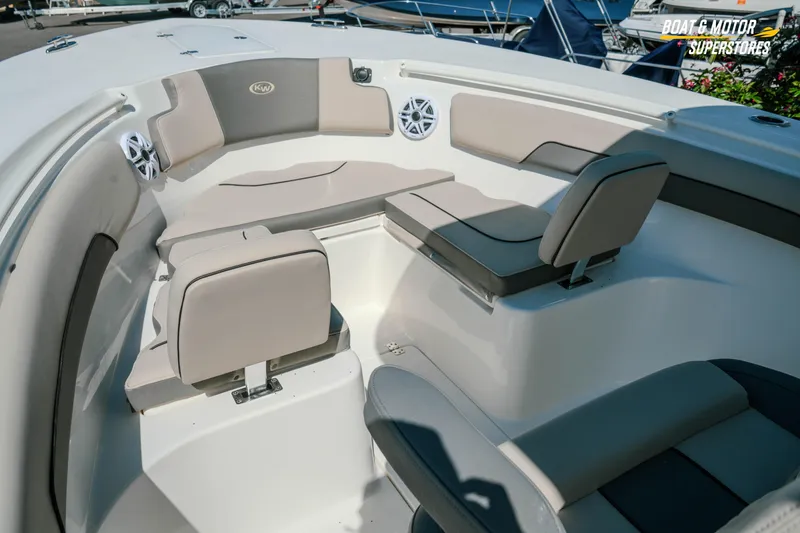 Slide: The Image of 2026 Key West 260 Center Console boat interior with cushioned seating and speakers. - 23