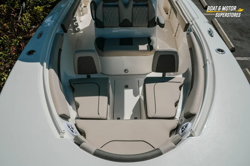 Slide: The Image of 2026 Key West 260 Center Console boat interior with cushioned seating and storage compartments. - 26
