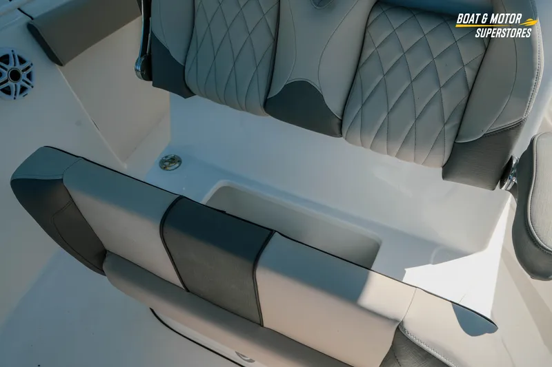Slide: The Image of 2026 Key West 260 Center Console boat seat with diamond-stitched upholstery and storage compartment. - 28