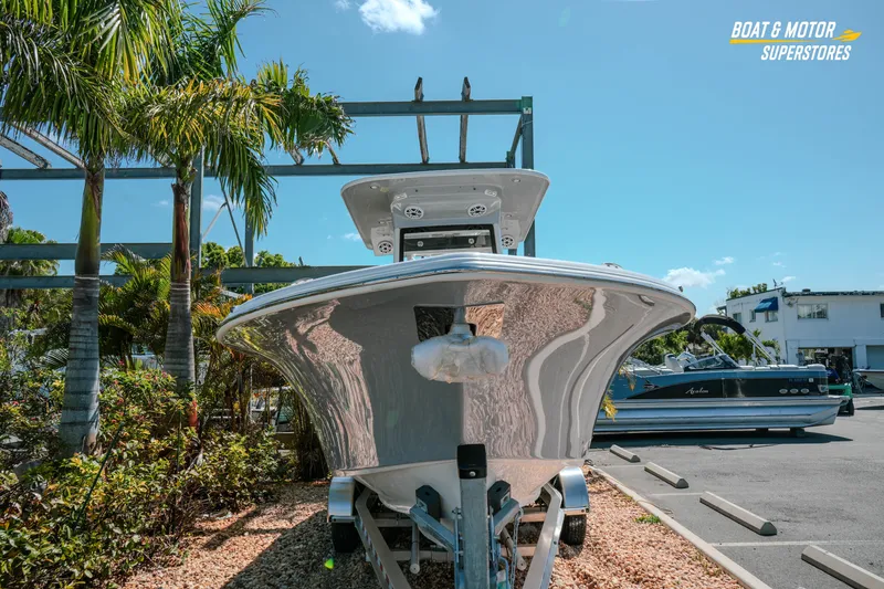 Slide: The Image of 2026 Key West 260 Center Console boat displayed outdoors at a dealership. - 3