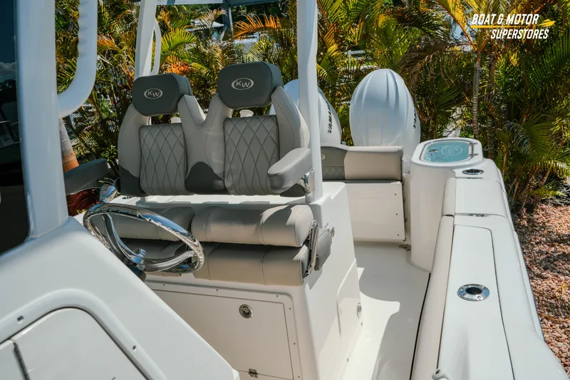 Slide: The Image of 2026 Key West 260 Center Console boat interior with dual seats and steering wheel. - 30
