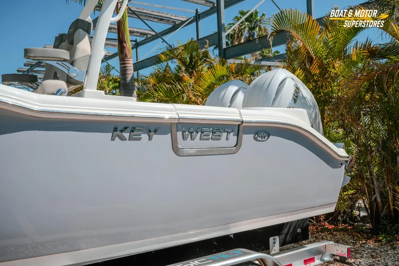 Slide: The Image of 2026 Key West 260 Center Console boat with dual engines, displayed outdoors. - 5