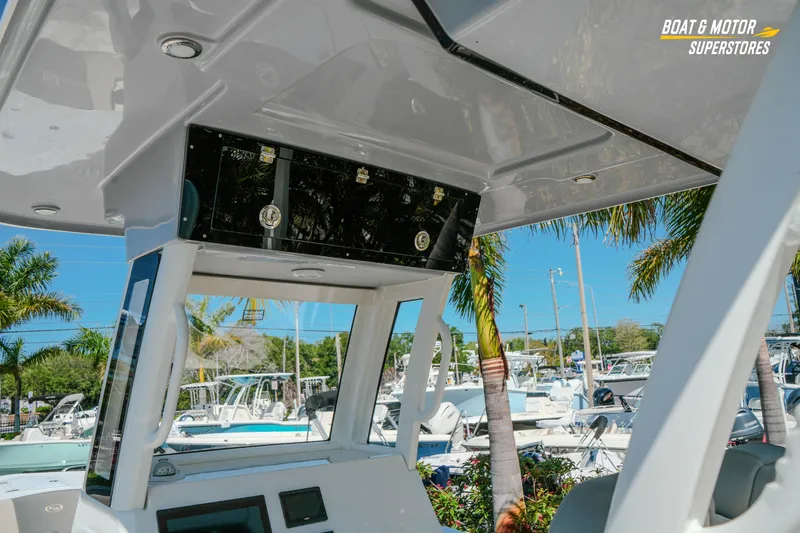 Slide: The Image of 2026 Key West 260 Center Console boat interior with palm trees in background. - 9