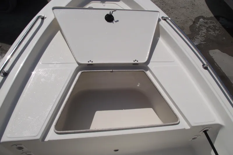 Slide: The Image of 2017 Key West 1520 Center Console boat storage compartment with open hatch. - 10