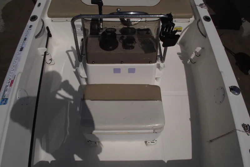 Slide: The Image of 2017 Key West 1520 Center Console boat interior with seating and control panel. - 11