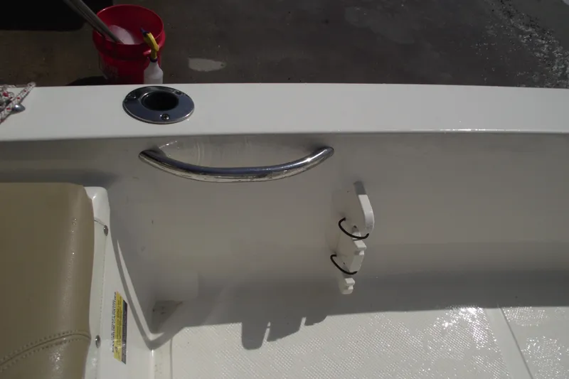 Slide: The Image of 2017 Key West 1520 Center Console boat interior with rod holder and handle. - 14