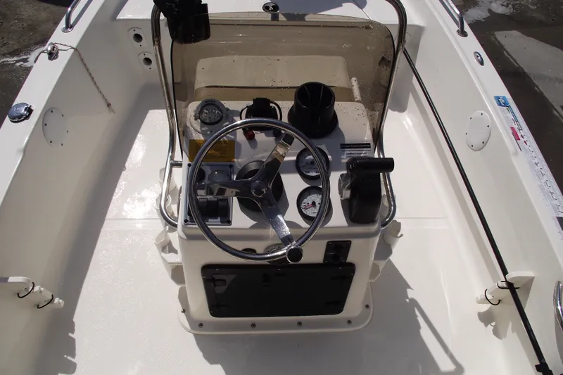 Slide: The Image of 2017 Key West 1520 Center Console boat interior with steering wheel and gauges. - 15