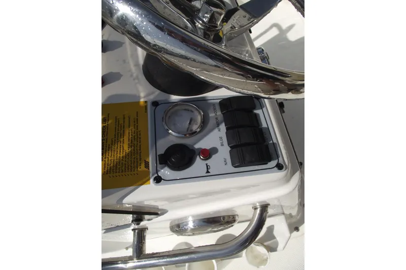 Slide: The Image of Control panel of a 2017 Key West 1520 Center Console boat with steering wheel. - 16