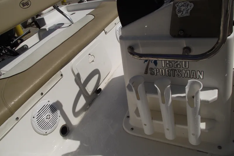 Slide: The Image of Key West 1520 Center Console boat interior, featuring rod holders and seating, 2017 model. - 18