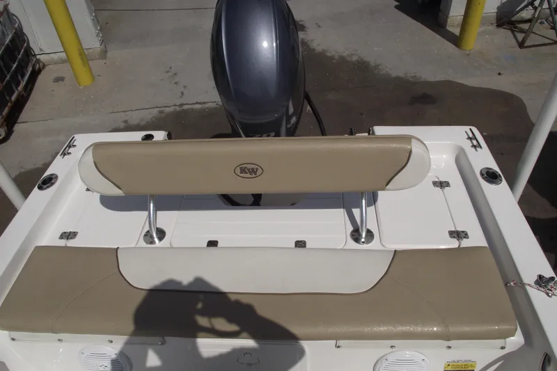 Slide: The Image of 2017 Key West 1520 Center Console boat with beige seating and motor. - 19