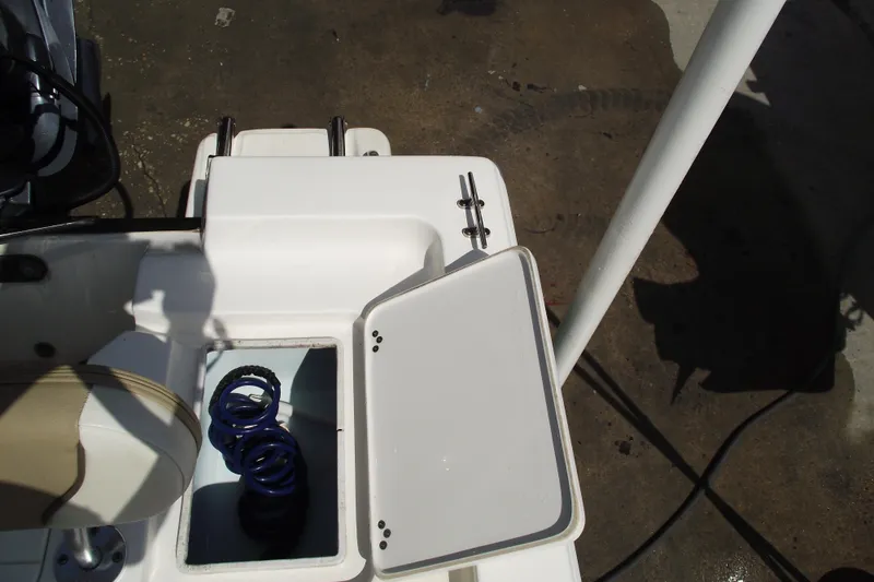 Slide: The Image of 2017 Key West 1520 Center Console boat with open storage compartment. - 20