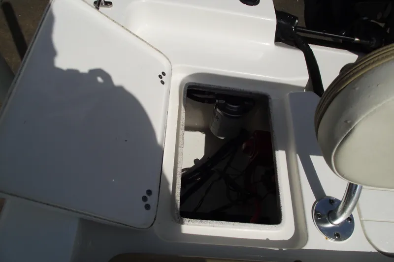 Slide: The Image of Open storage compartment on a 2017 Key West 1520 Center Console boat. - 21