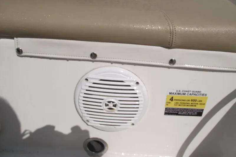 Slide: The Image of 2017 Key West 1520 Center Console boat interior with speaker and capacity label. - 22