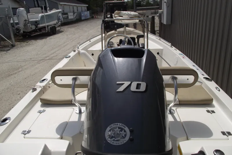 Slide: The Image of 2017 Key West 1520 Center Console boat with Yamaha 70 engine, docked outdoors. - 4