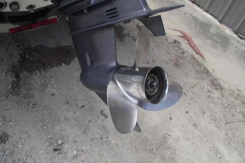 Slide: The Image of Propeller of a 2017 Key West 1520 Center Console boat on concrete surface. - 5