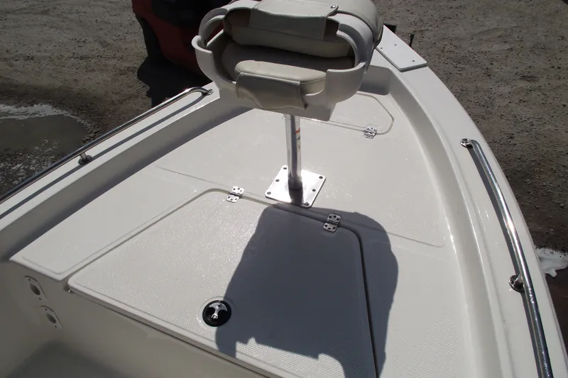 Slide: The Image of 2017 Key West 1520 Center Console boat deck with seat and storage compartments. - 6