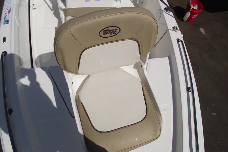 Slide: The Image of 2017 Key West 1520 Center Console boat seat with beige and white upholstery. - 7