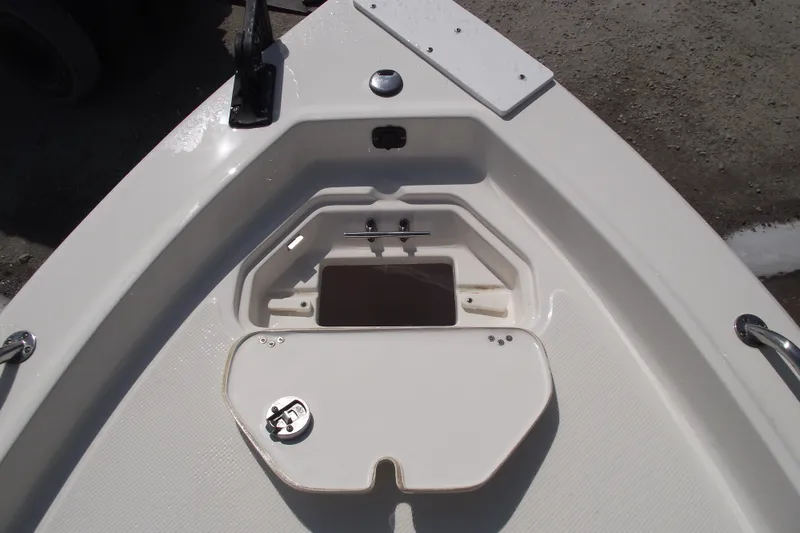 Slide: The Image of 2017 Key West 1520 Center Console boat deck with storage compartment open. - 9