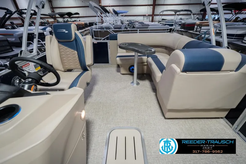 Slide: The Image of Interior of a 2026 Bennington 21 SLJ pontoon boat with plush seating and modern design. - 13
