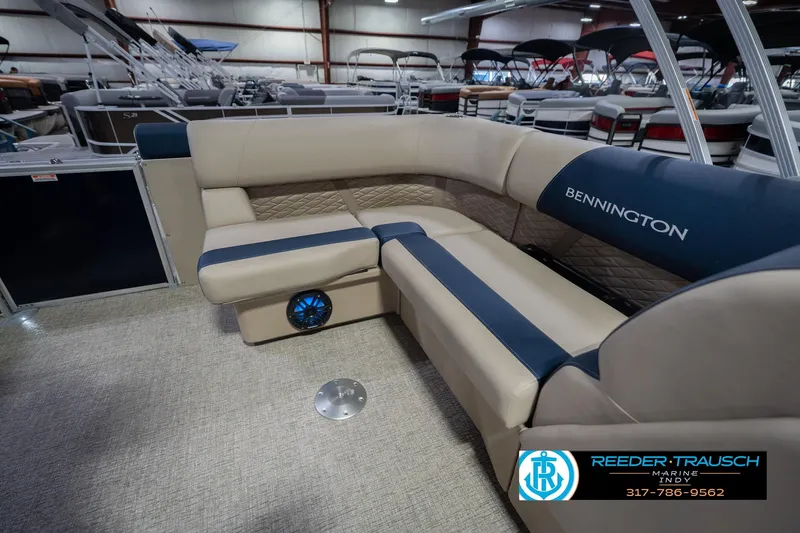 Slide: The Image of 2026 Bennington 21 SLJ boat interior with beige and blue seating at Reeder-Trausch Marine. - 24